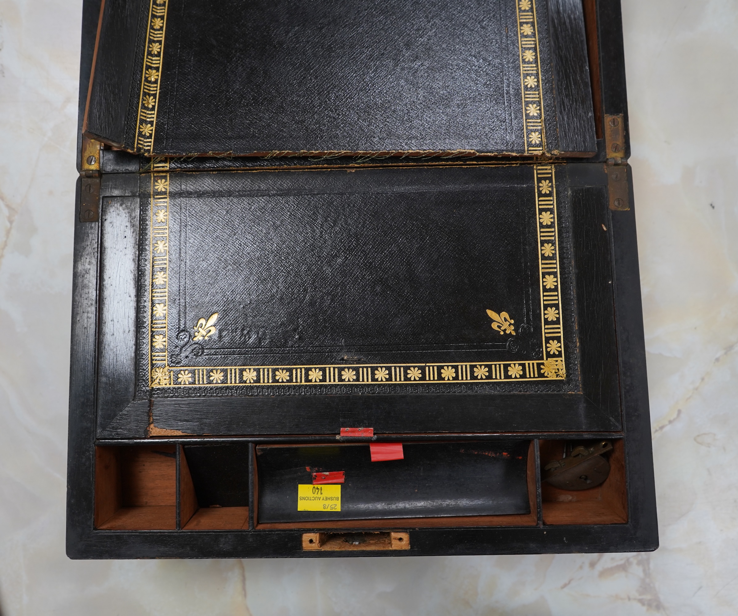 A brass bound walnut writing box with tooled leather slope, 35cm wide